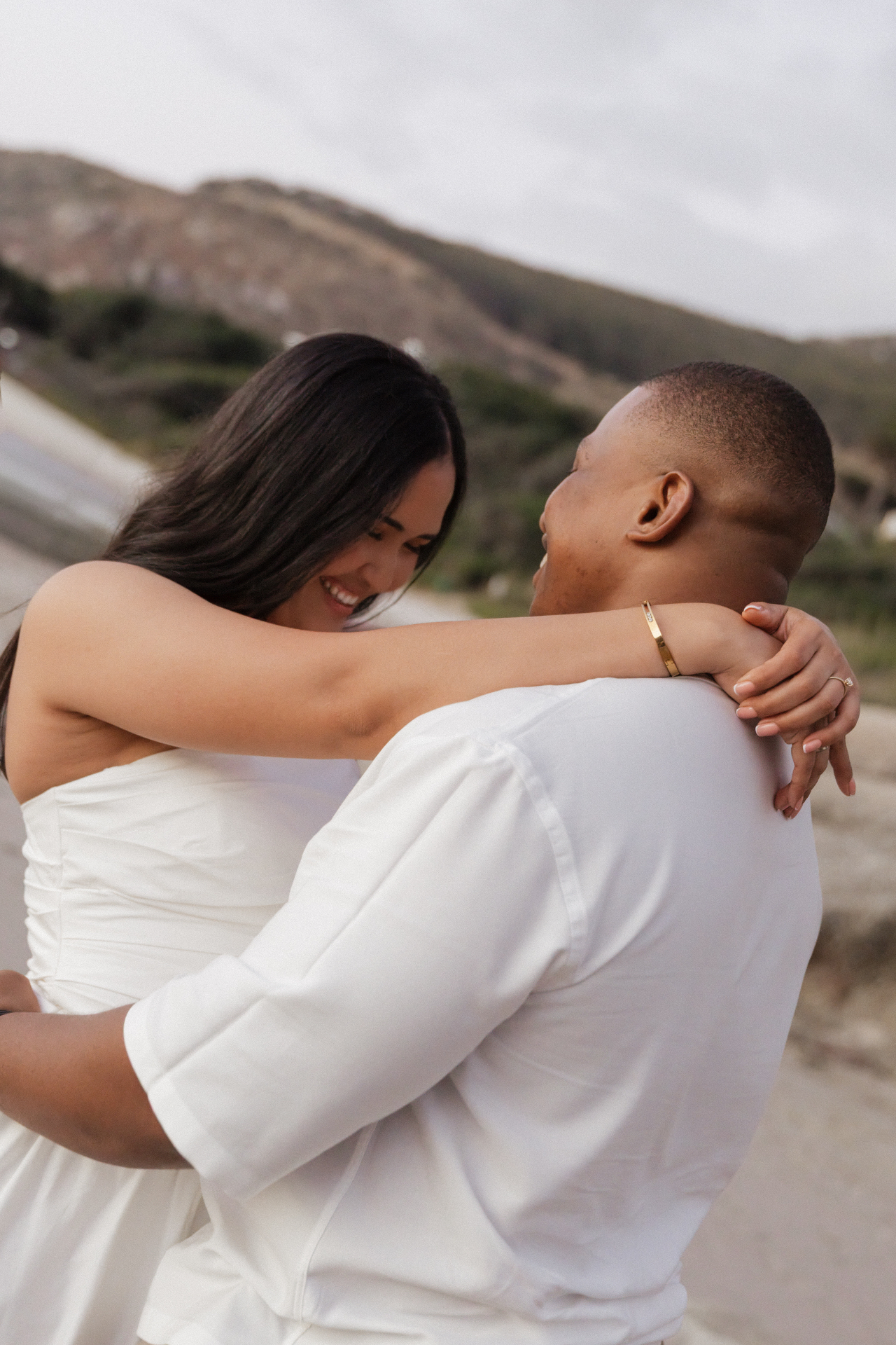Cebo and Ray-Ann embracing